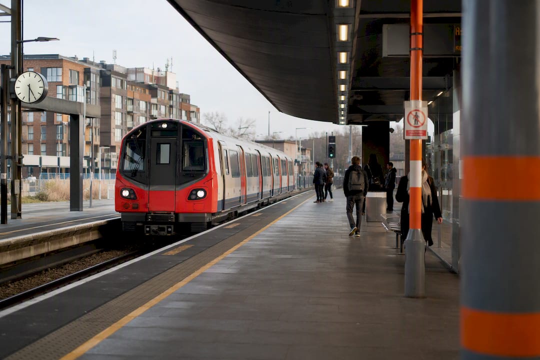 Clean Watford Junction train platform with train arriving