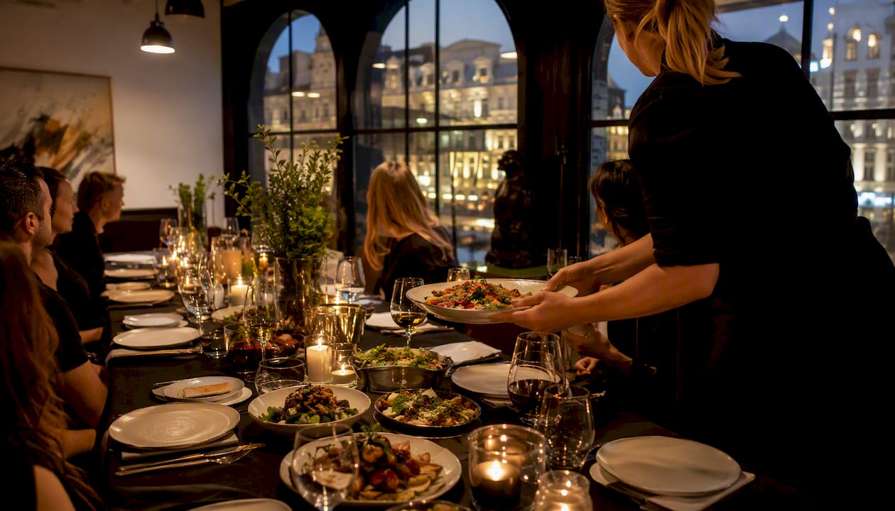 Communal dining table set for London supper club