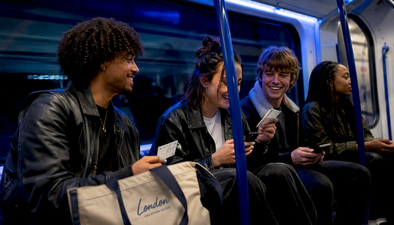 Group traveling on London Northern line subway